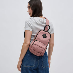 Woman wearing Mauve Sol and Selene Hustle Sling Backpack 841764105576 View 1 | Mauve