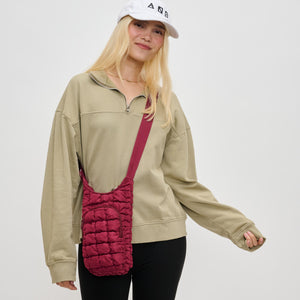 Woman wearing Burgundy Sol and Selene Let It Flow - Quilted Puffer Crossbody 841764110389 View 1 | Burgundy