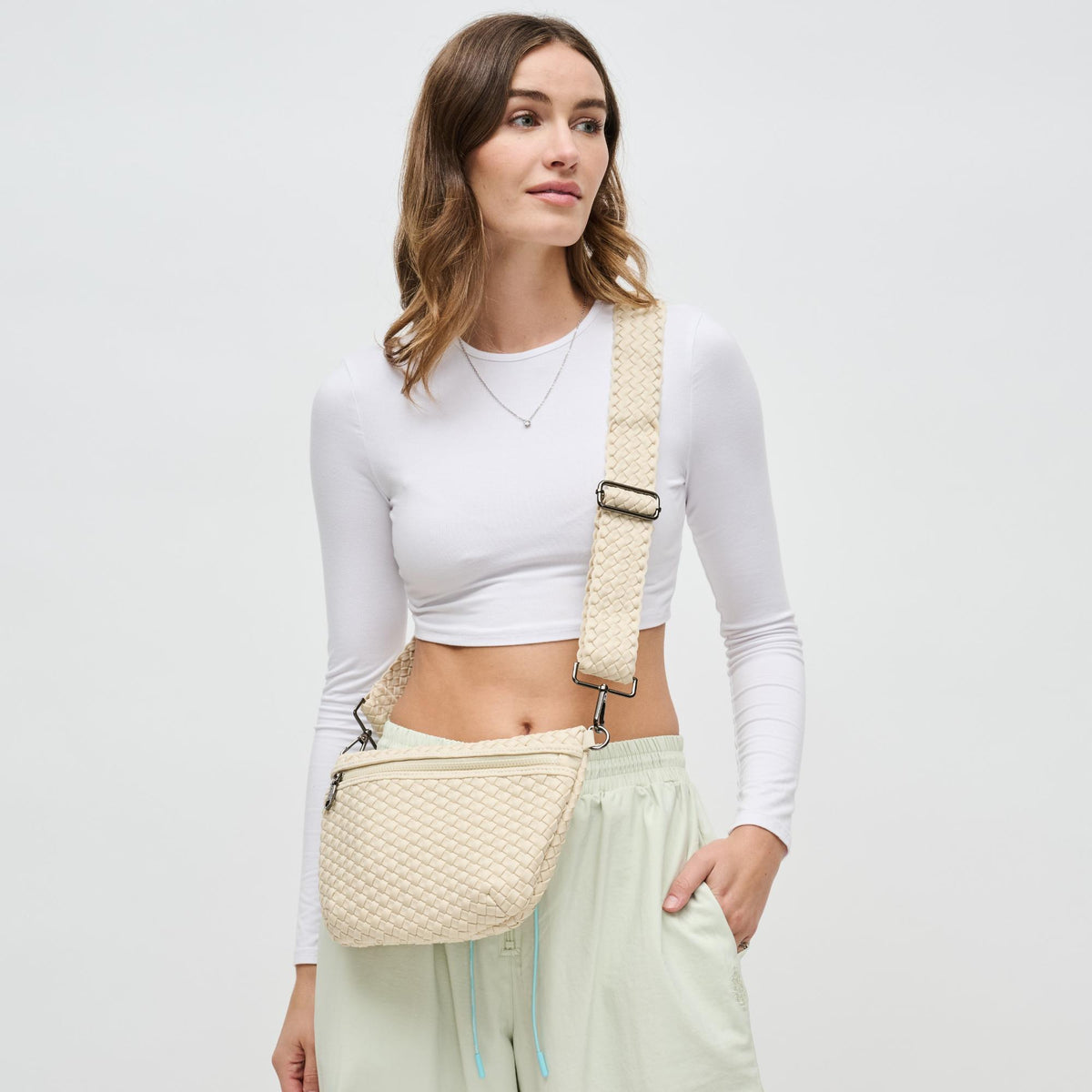 Woman wearing Cream Sol and Selene Ethereal - Woven Neoprene Crossbody 841764110846 View 1 | Cream