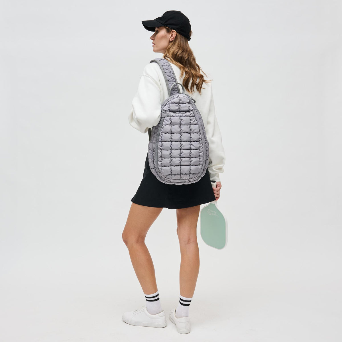 Woman wearing Grey Sol and Selene Match Point - Pickleball & Paddle Tennis Sling Backpack 841764111171 View 3 | Grey