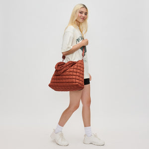 Woman wearing Rust Sol and Selene Elevate Hobo 841764110570 View 3 | Rust