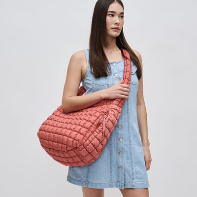 Woman wearing Terracotta Sol and Selene Revive Hobo 841764109550 View 1 | Terracotta