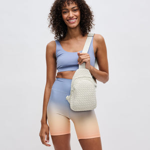 Woman wearing Bone Sol and Selene Beyond The Horizon - Woven Neoprene Sling Backpack 841764109062 View 2 | Bone