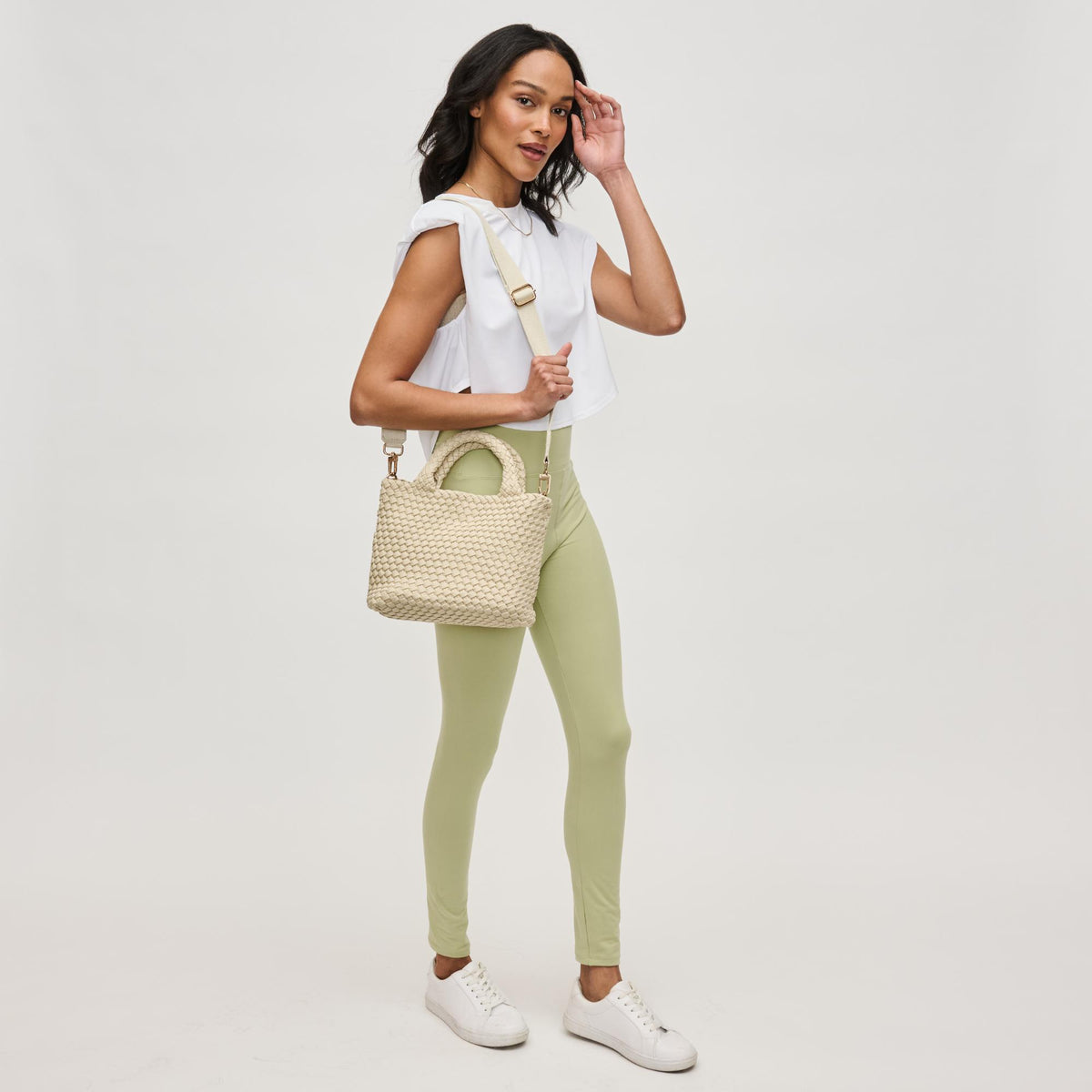 Woman wearing Beige Sol and Selene Sky&#39;s The Limit - Small Sustainable Crossbody 841764111683 View 4 | Beige