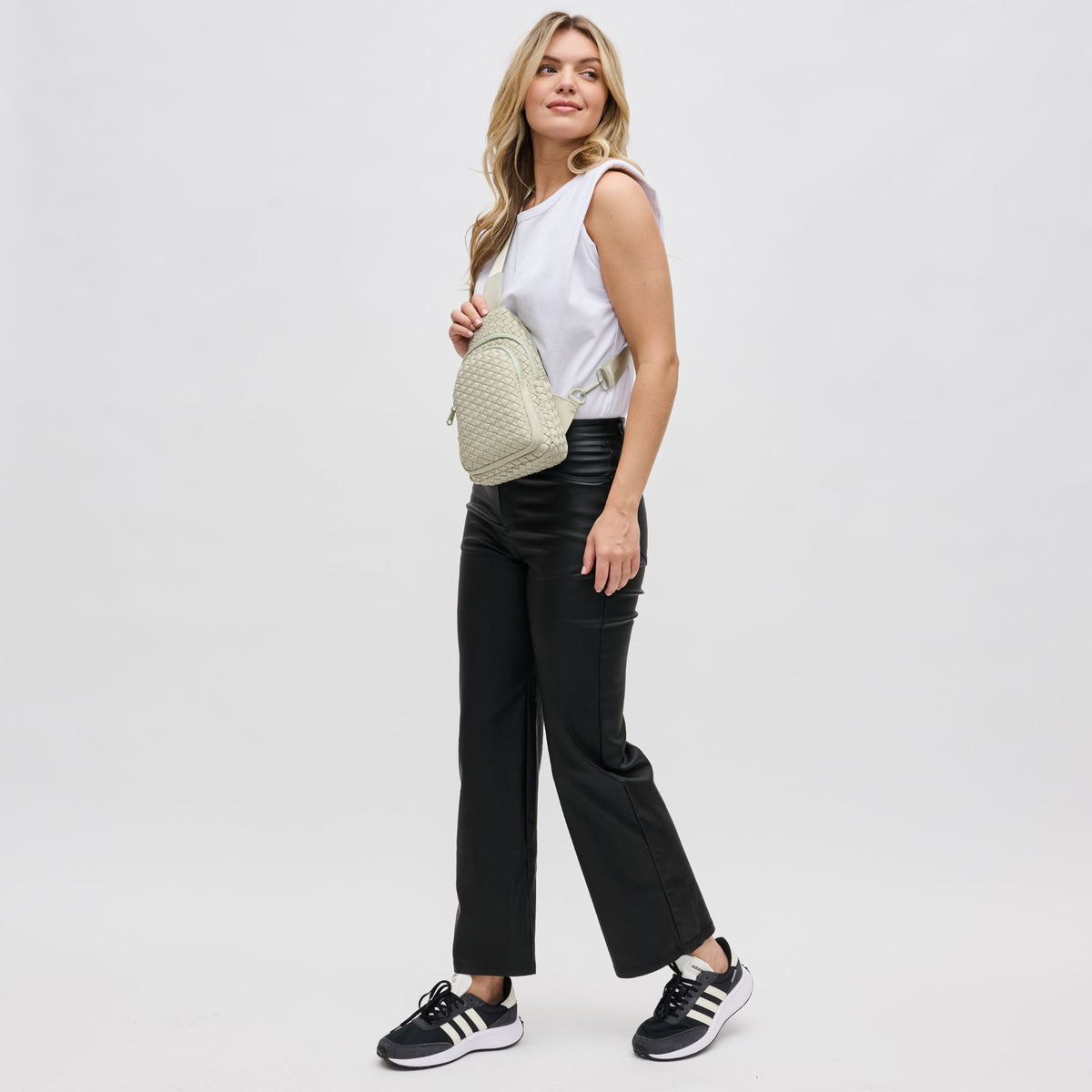 Woman wearing Sage Sol and Selene Beyond The Horizon - Woven Neoprene Sling Backpack 841764109086 View 4 | Sage