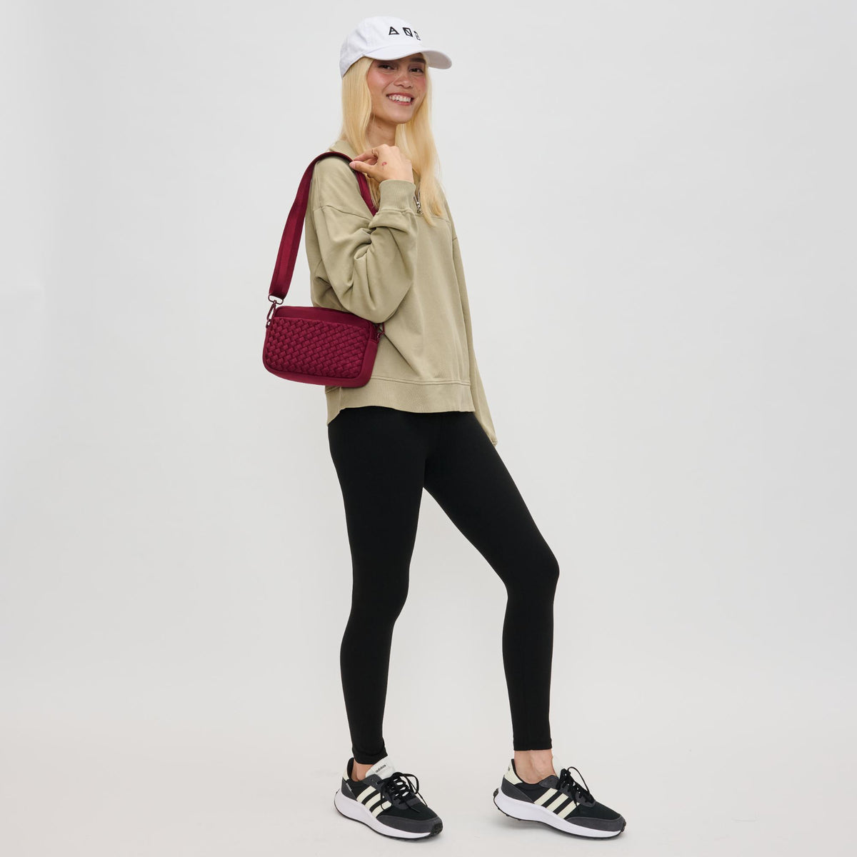 Woman wearing Wine Sol and Selene Inspiration - Woven Neoprene Crossbody 841764110488 View 3 | Wine