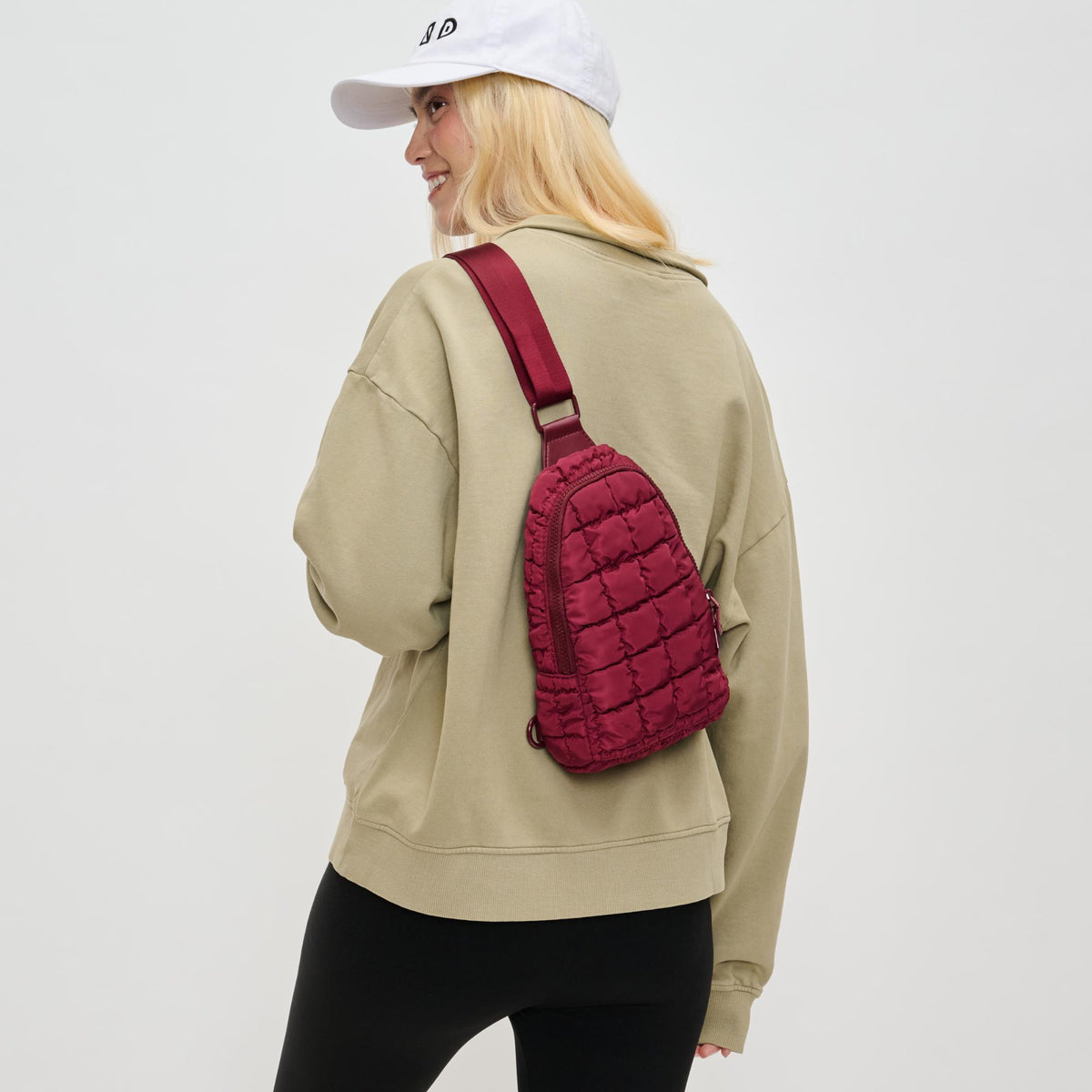 Woman wearing Burgundy Sol and Selene Rejuvenate Sling Backpack 841764110716 View 2 | Burgundy