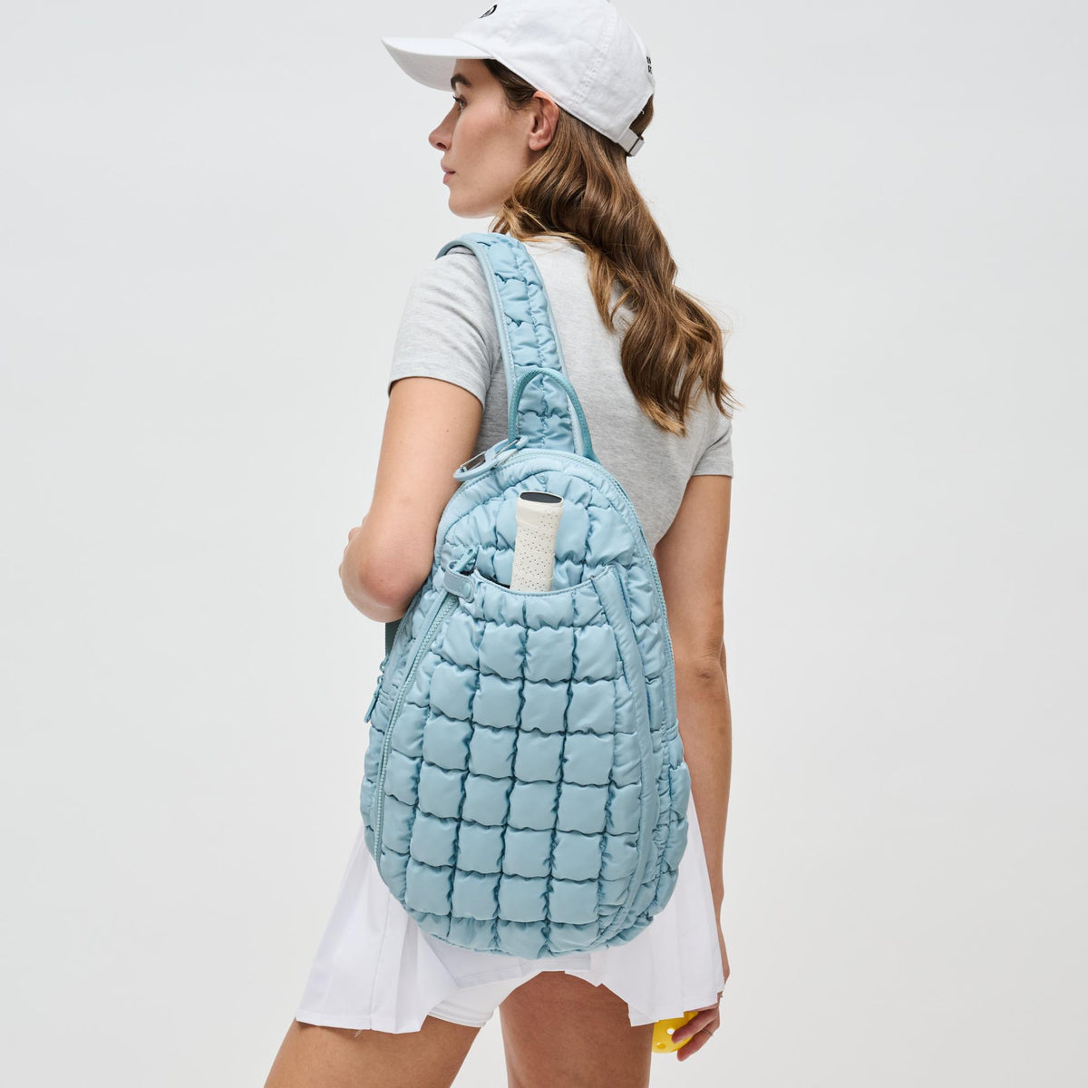 Woman wearing Sky Blue Sol and Selene Match Point - Pickleball & Paddle Tennis Sling Backpack 841764111164 View 3 | Sky Blue