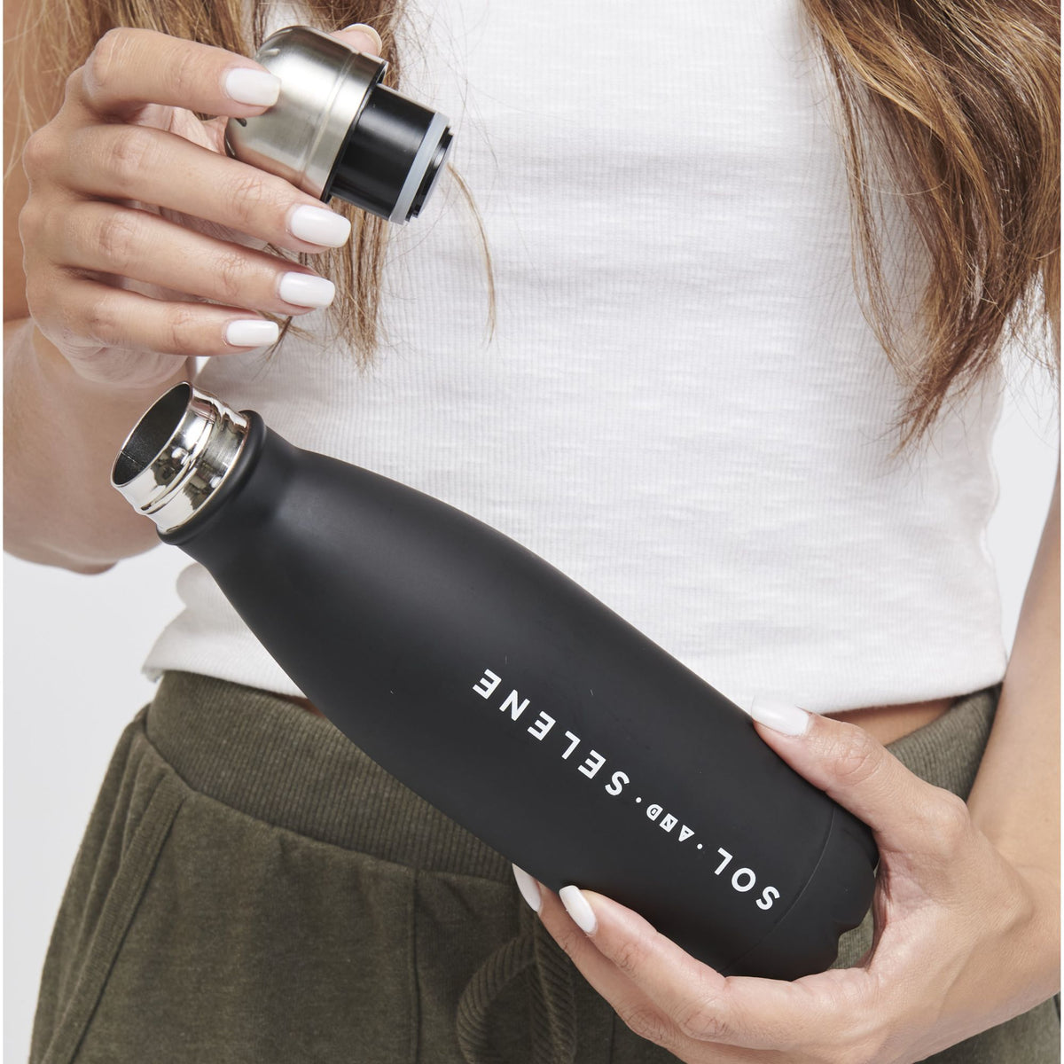 Woman wearing Matte Black Sol and Selene Water Bottle Water Bottle 841764102254 View 2 | Matte Black