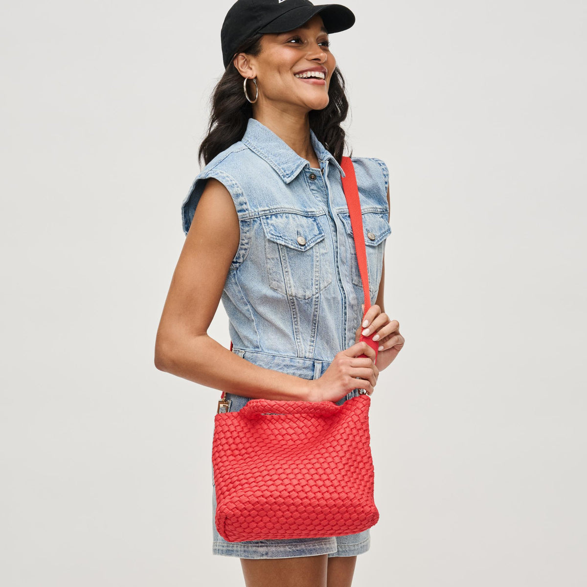 Woman wearing Coral Sol and Selene Sky&#39;s The Limit - Small Sustainable Crossbody 841764111713 View 3 | Coral