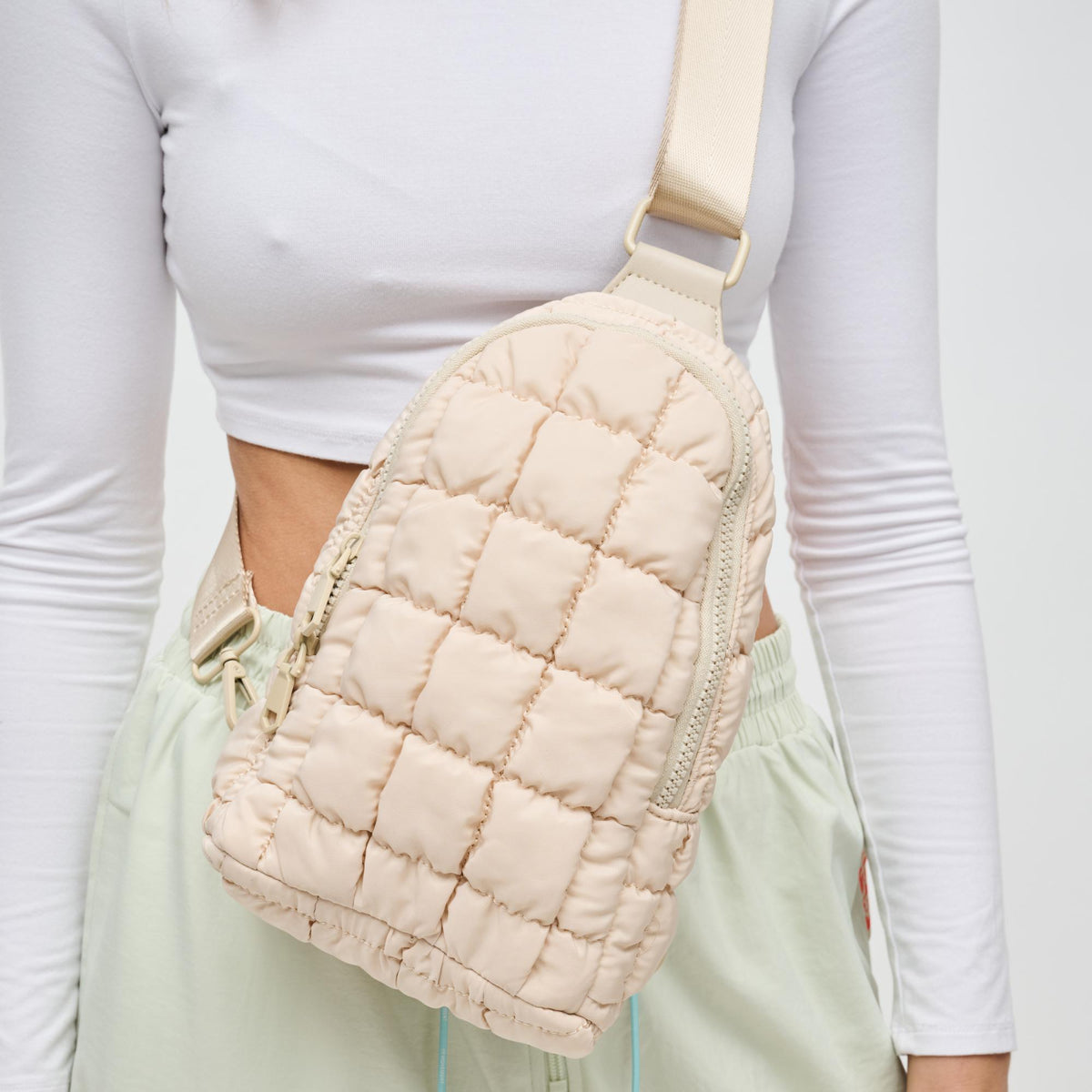 Woman wearing Cream Sol and Selene Rejuvenate Sling Backpack 841764108652 View 4 | Cream