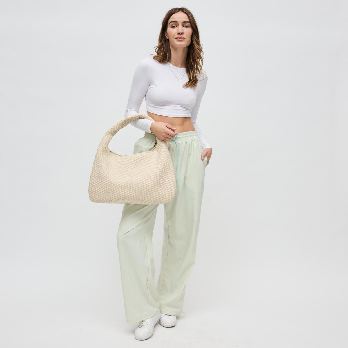 Woman wearing Cream Sol and Selene Dare to Dream - Large Woven Neoprene Hobo 841764110921 View 3 | Cream