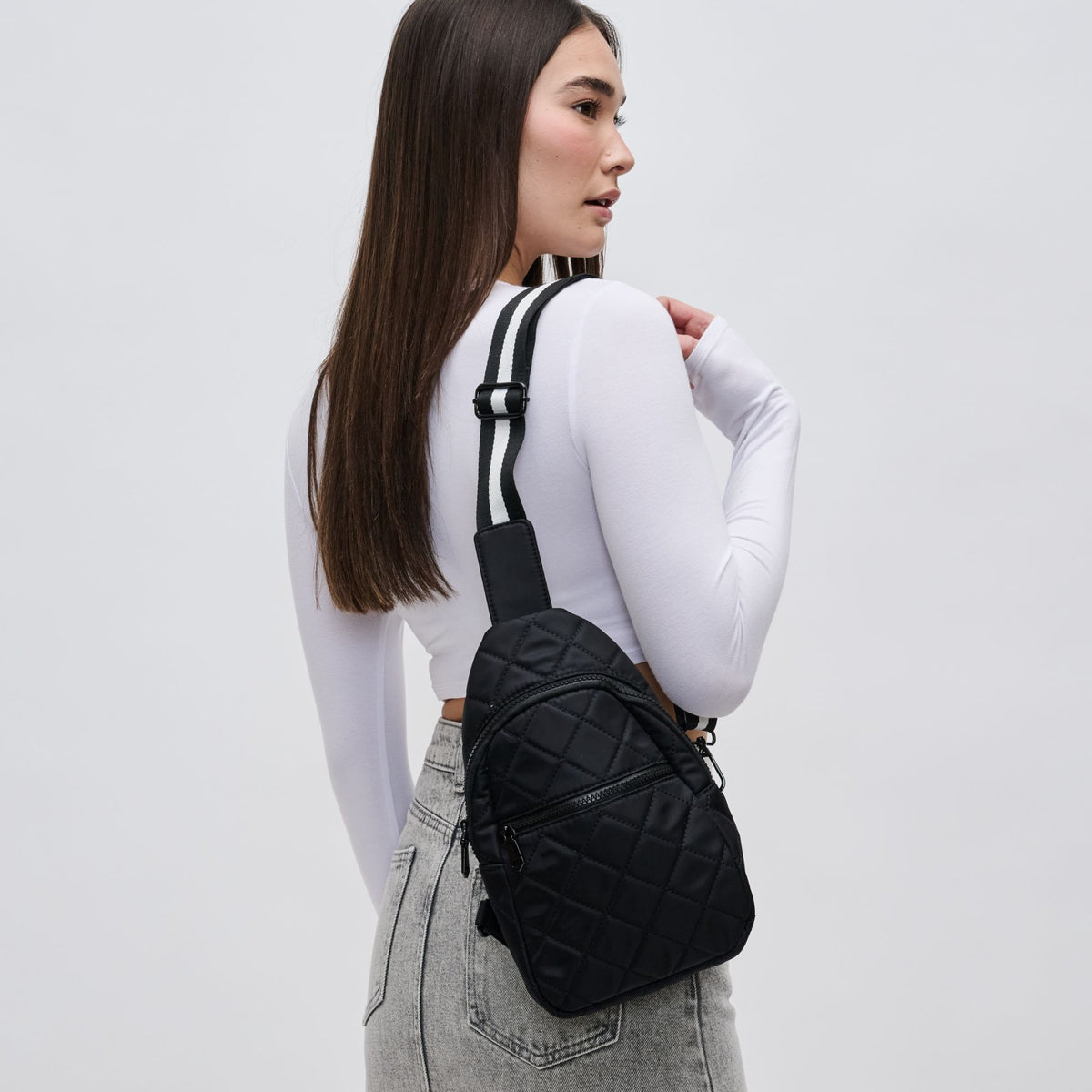 Woman wearing Black Sol and Selene Motivator Sling Backpack 841764106856 View 1 | Black