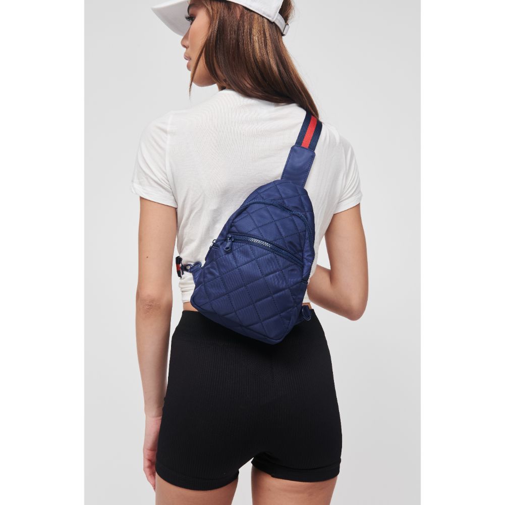 Woman wearing Navy Sol and Selene Motivator Sling Backpack 841764106894 View 1 | Navy