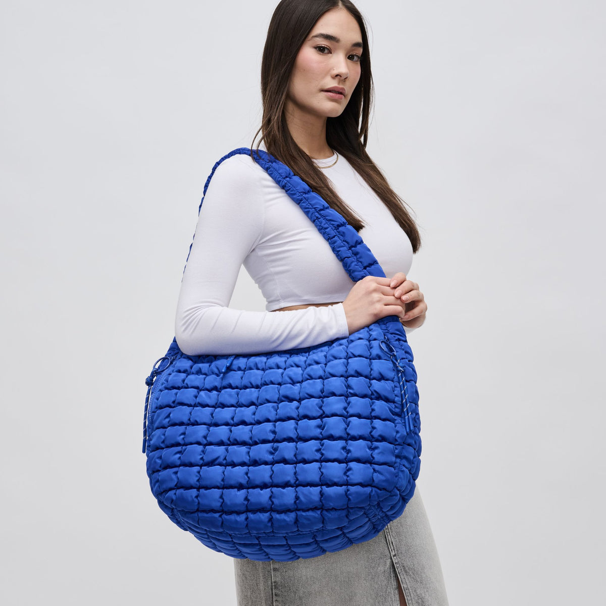 Woman wearing Cobalt Sol and Selene Revive Hobo 841764108577 View 1 | Cobalt