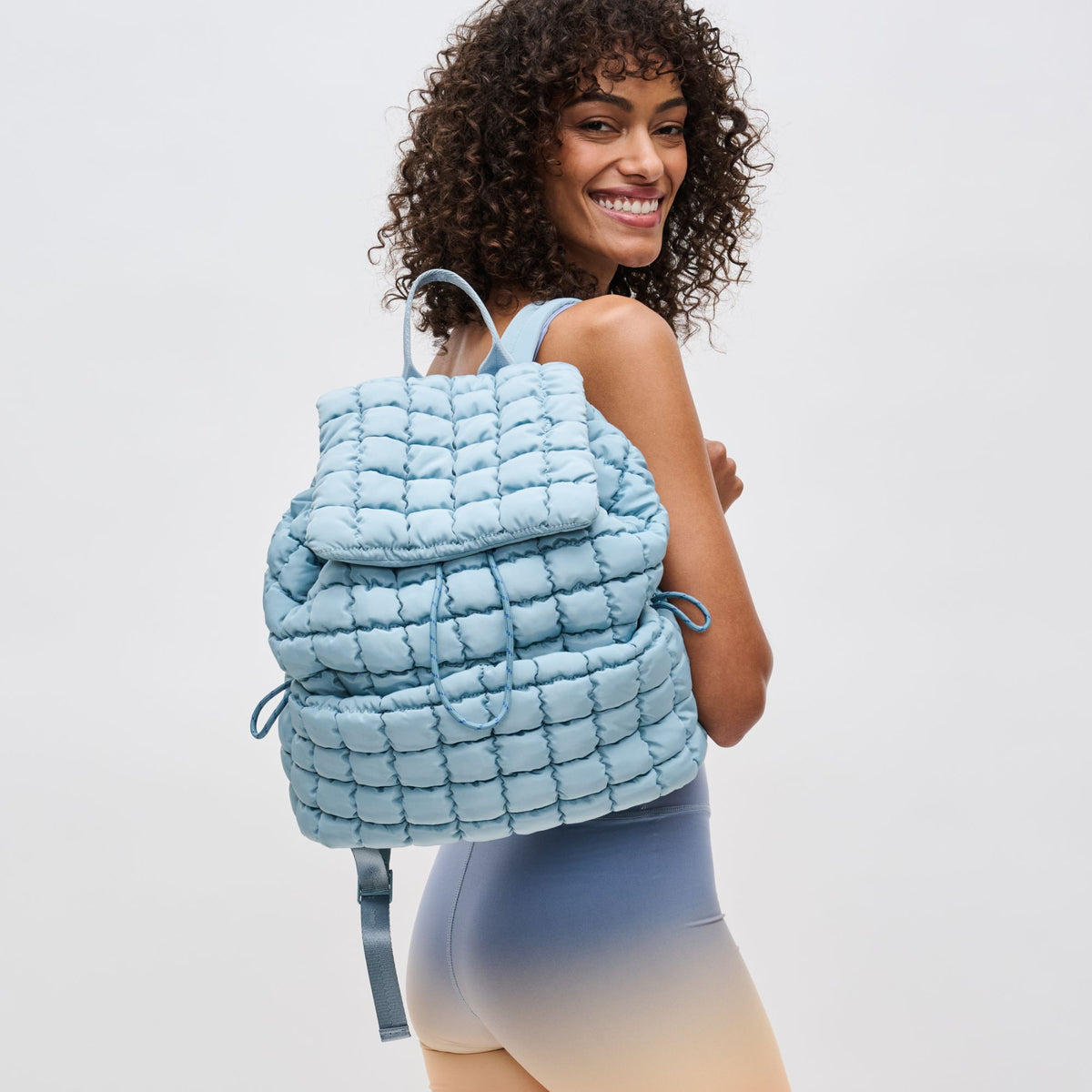 Woman wearing Sky Blue Sol and Selene Vitality Backpack 841764109499 View 1 | Sky Blue