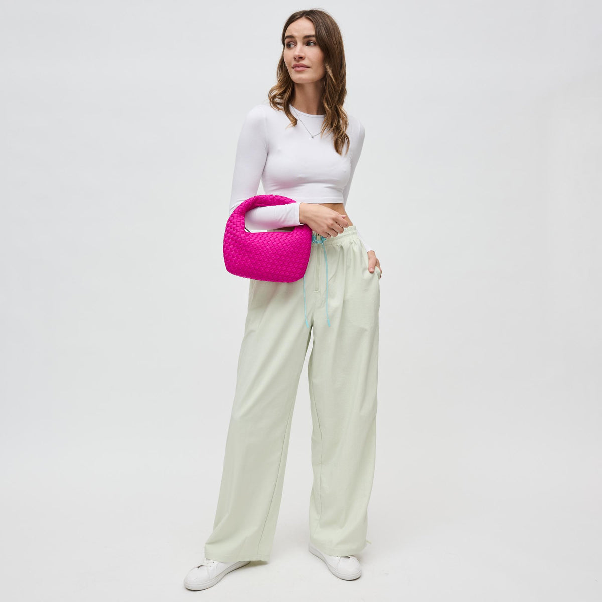 Woman wearing Fuchsia Sol and Selene Dare to Dream - Small Woven Neoprene Clutch 841764111102 View 3 | Fuchsia