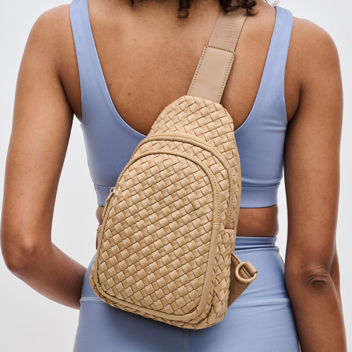 Woman wearing Nude Sol and Selene Beyond The Horizon - Woven Neoprene Sling Backpack 841764108041 View 4 | Nude