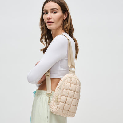 Woman wearing Cream Sol and Selene Rejuvenate Sling Backpack 841764108652 View 1 | Cream