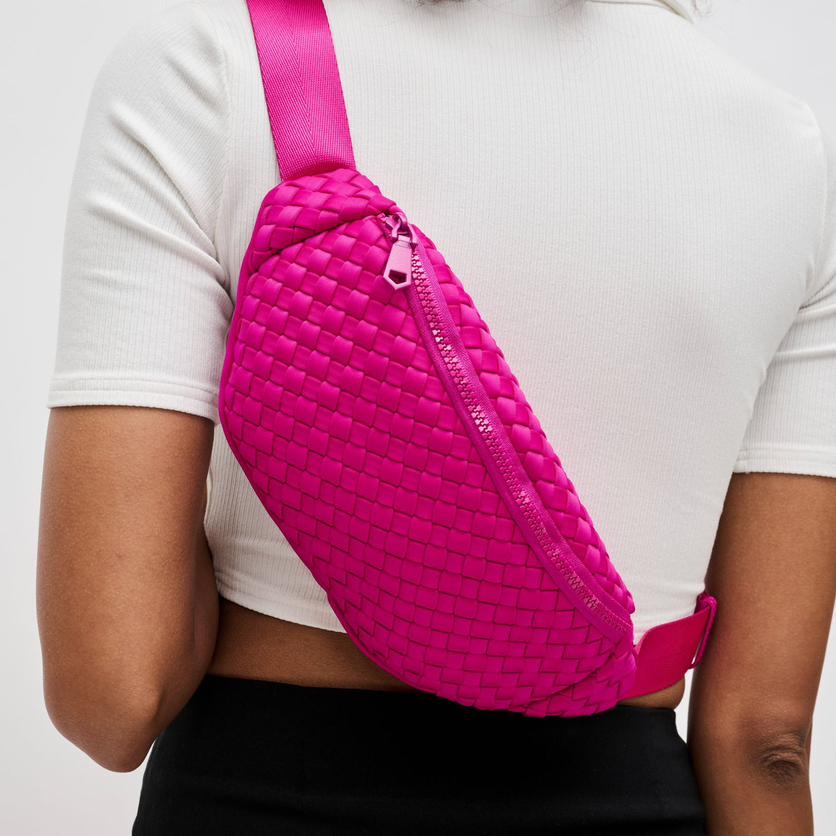 Woman wearing Fuchsia Sol and Selene Aim High Belt Bag 841764108126 View 1 | Fuchsia