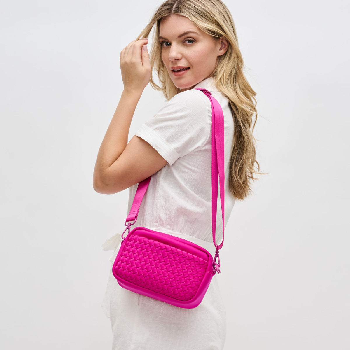 Woman wearing Fuchsia Sol and Selene Inspiration - Woven Neoprene Crossbody 841764108331 View 2 | Fuchsia