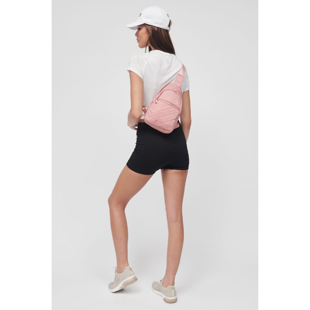 Woman wearing Pastel Pink Sol and Selene Motivator Sling Backpack 841764106863 View 2 | Pastel Pink