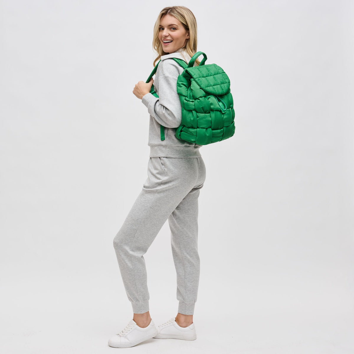 Woman wearing Kelly Green Sol and Selene Perception Backpack 841764107952 View 3 | Kelly Green