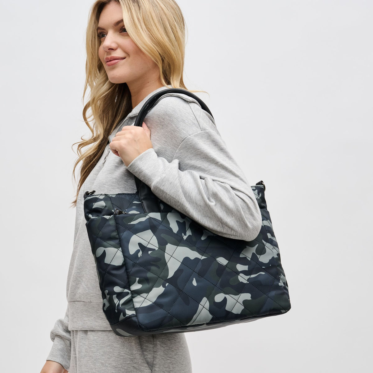 Woman wearing Green Camo Sol and Selene Motivator East West Tote 841764105712 View 2 | Green Camo