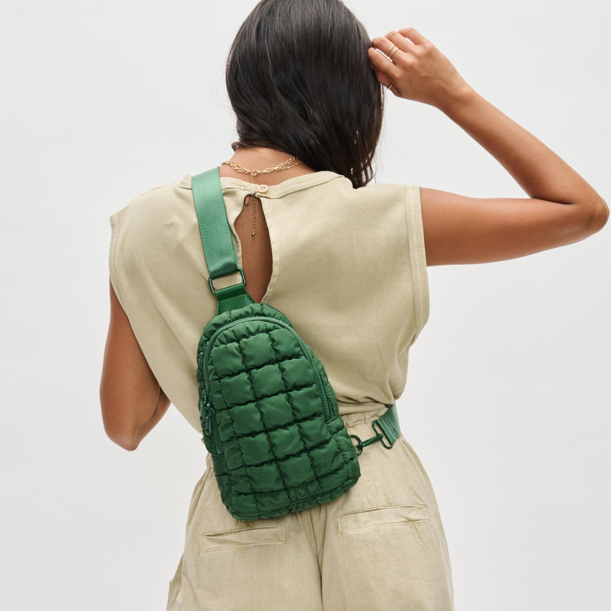 Woman wearing Emerald Sol and Selene Rejuvenate Sling Backpack 841764108645 View 2 | Emerald