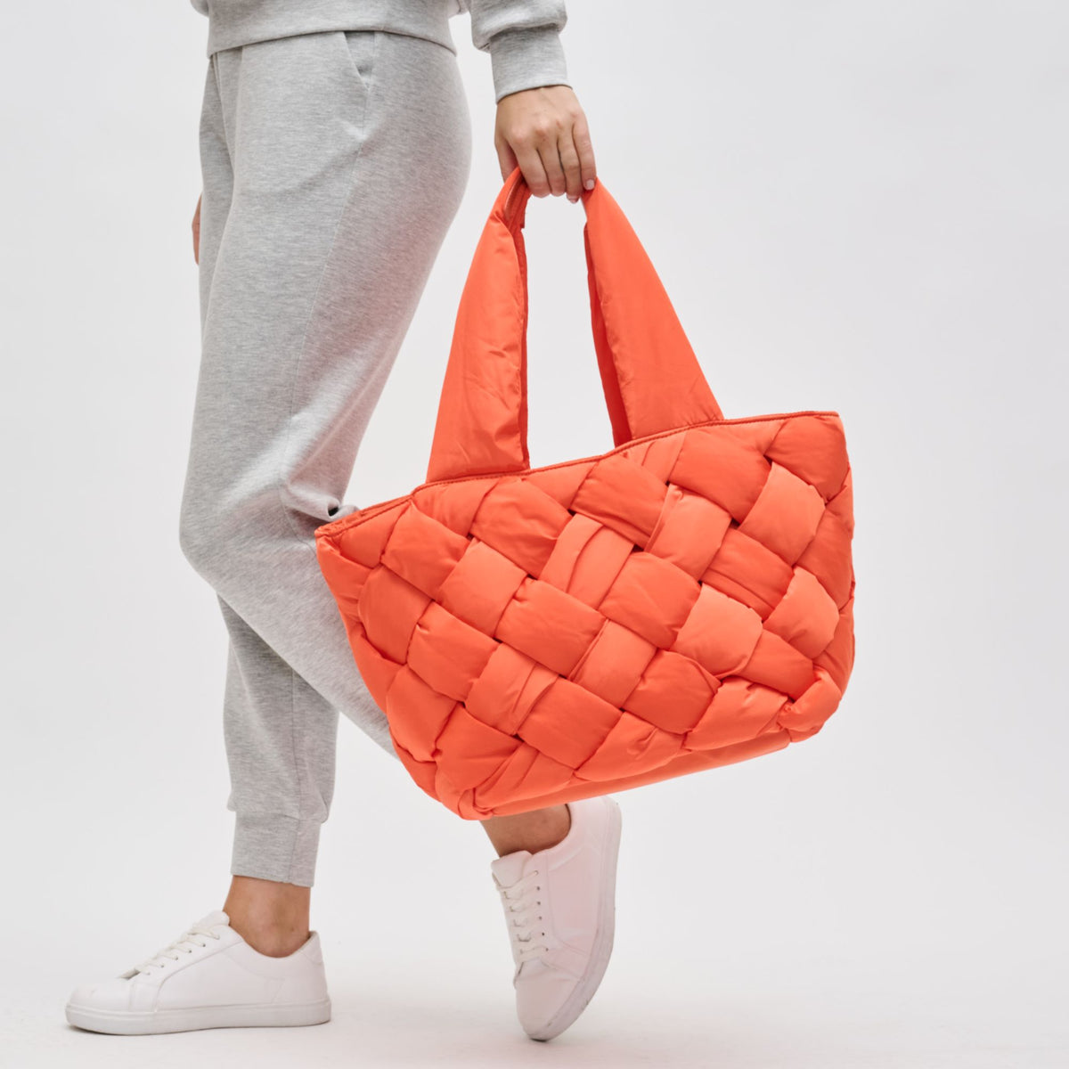 Woman wearing Tangerine Sol and Selene Intuition East West Tote 841764107310 View 1 | Tangerine