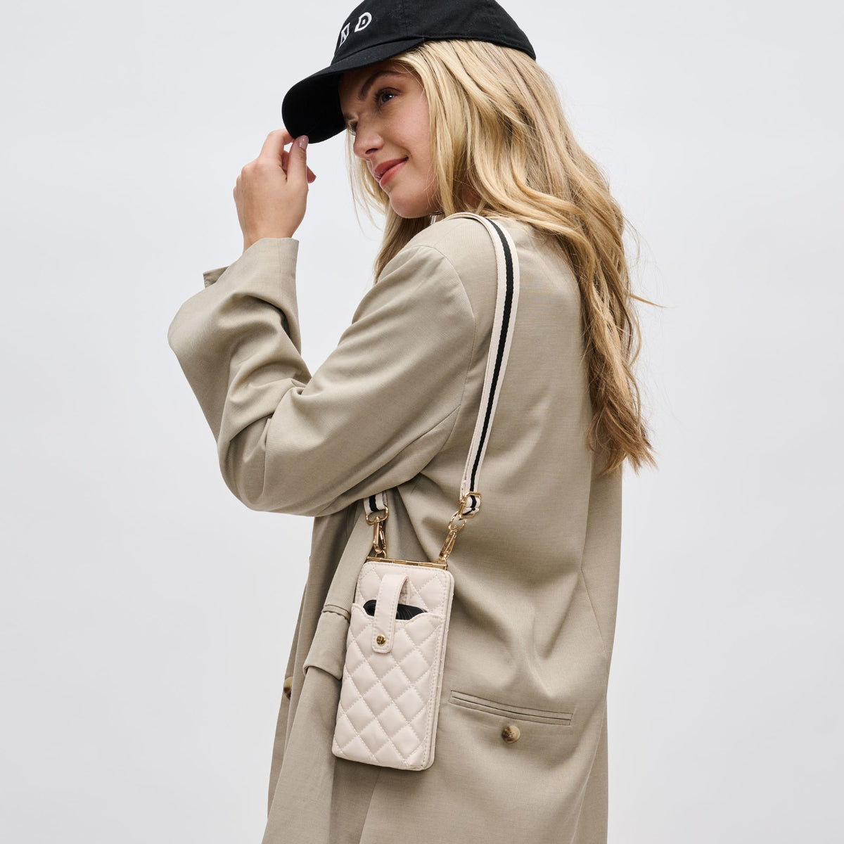 Woman wearing Cream Sol and Selene Duality - Quilted Cell Phone Crossbody 841764109352 View 2 | Cream