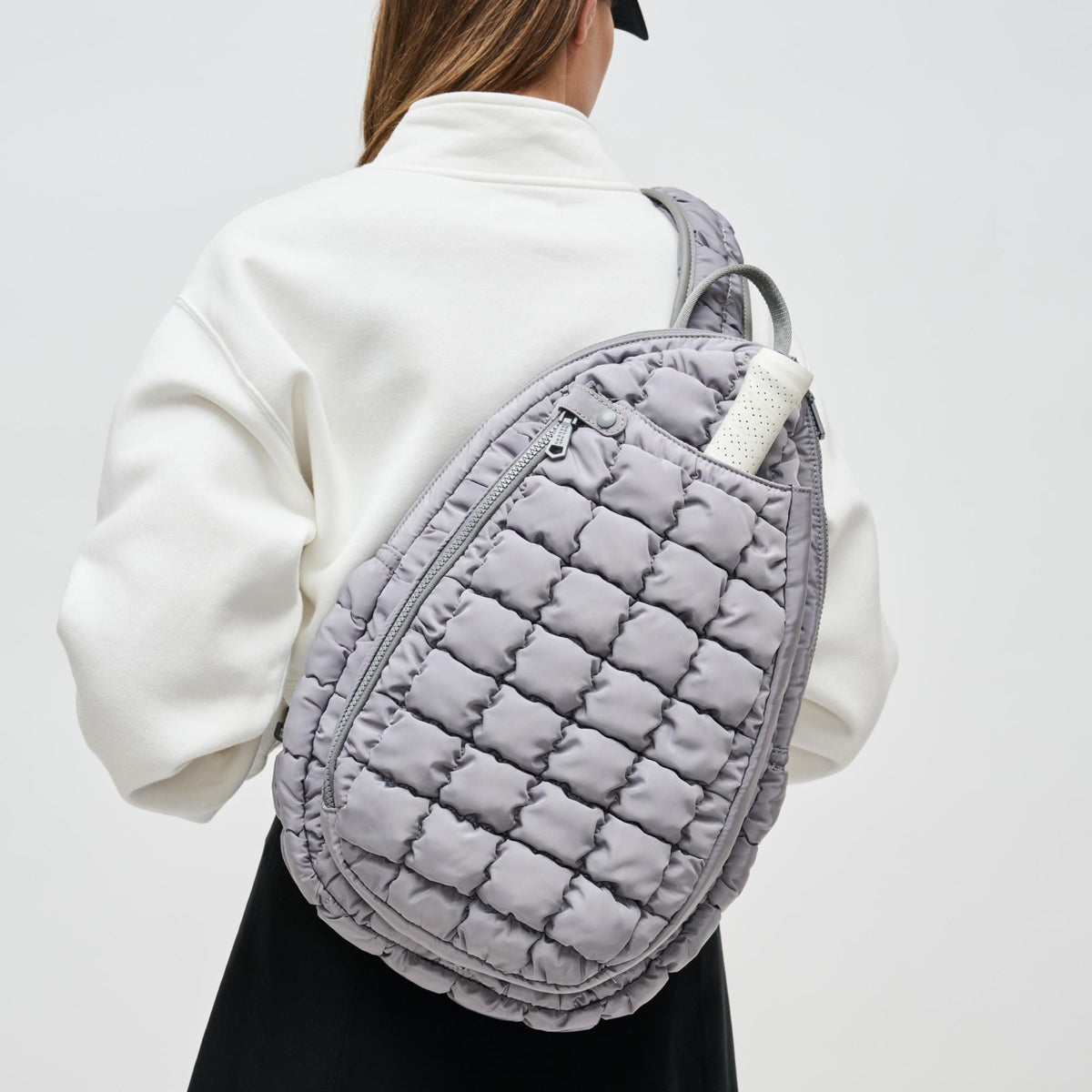 Woman wearing Grey Sol and Selene Match Point - Pickleball & Paddle Tennis Sling Backpack 841764111171 View 4 | Grey