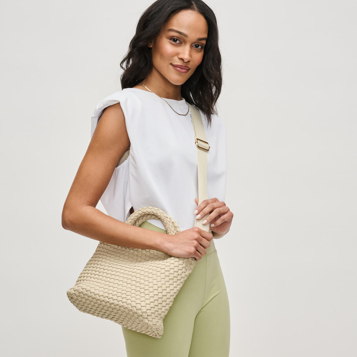 Woman wearing Beige Sol and Selene Sky&#39;s The Limit - Small Sustainable Crossbody 841764111683 View 3 | Beige