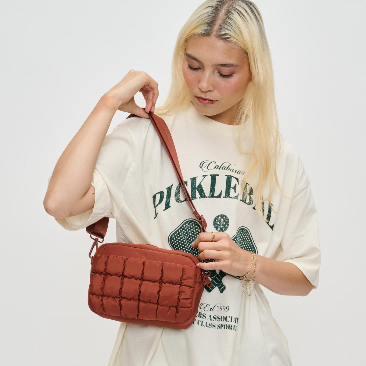 Woman wearing Rust Sol and Selene Inspiration - Quilted Nylon Crossbody 841764110600 View 2 | Rust