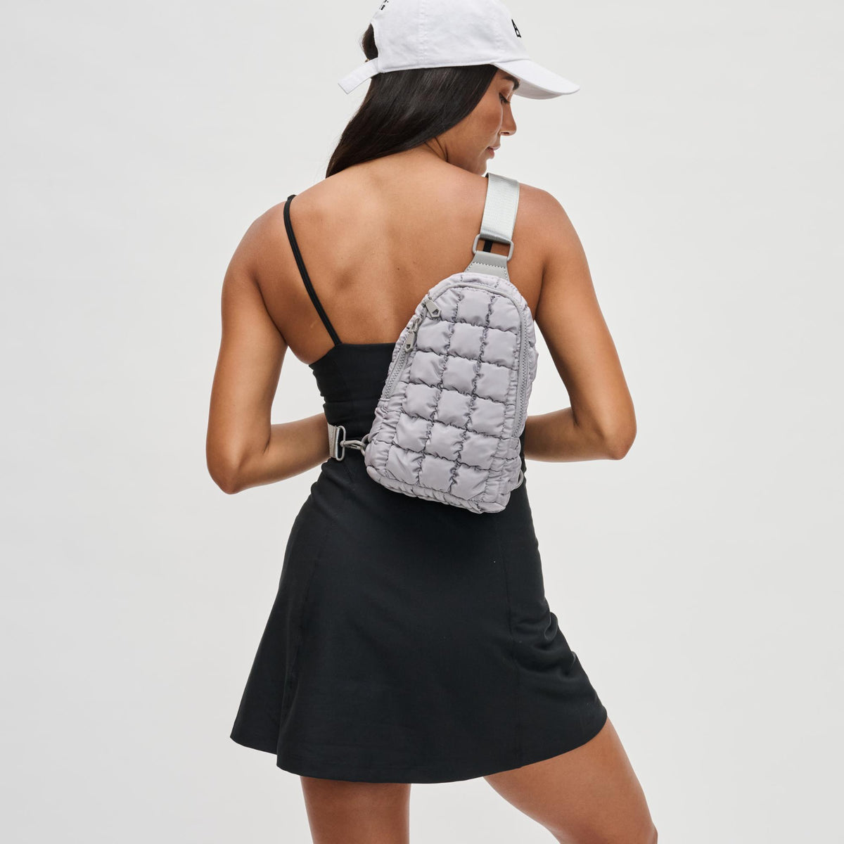 Woman wearing Grey Sol and Selene Rejuvenate Sling Backpack 841764109574 View 1 | Grey