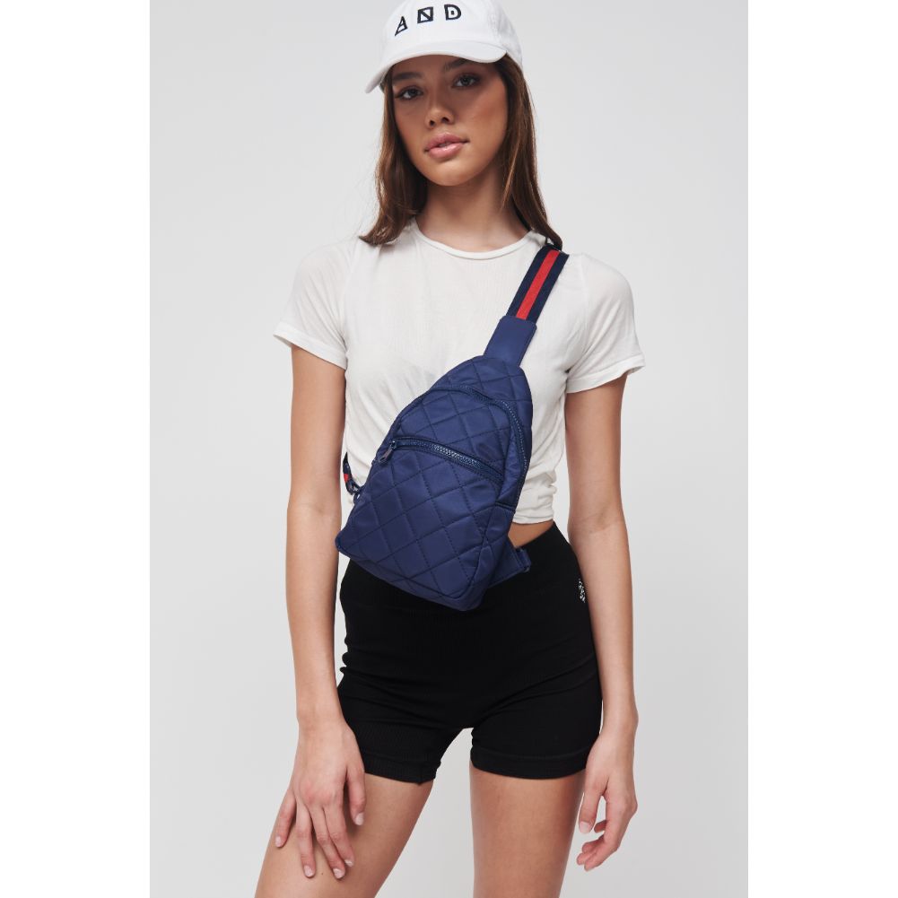 Woman wearing Navy Sol and Selene Motivator Sling Backpack 841764106894 View 3 | Navy