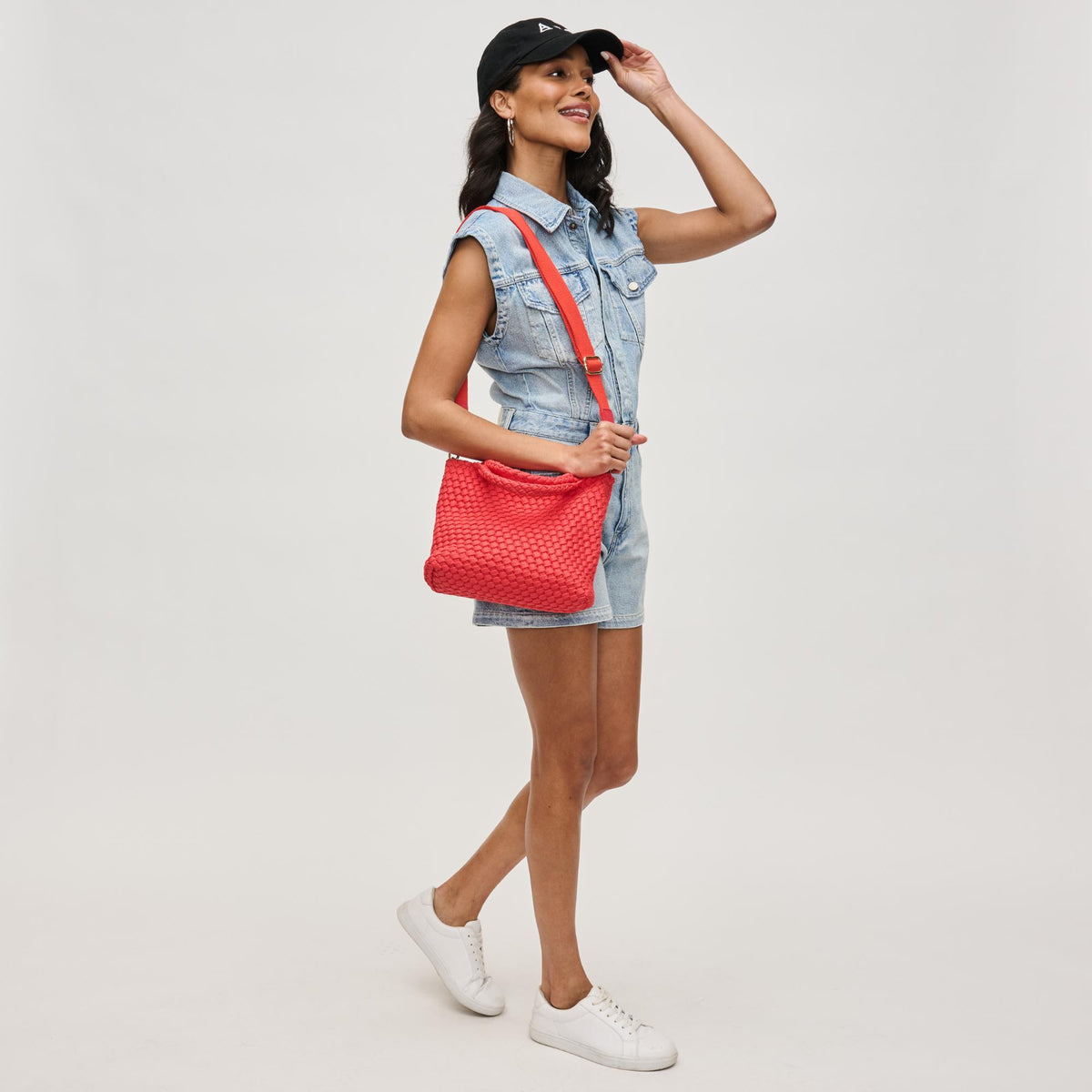 Woman wearing Coral Sol and Selene Sky&#39;s The Limit - Small Sustainable Crossbody 841764111713 View 4 | Coral