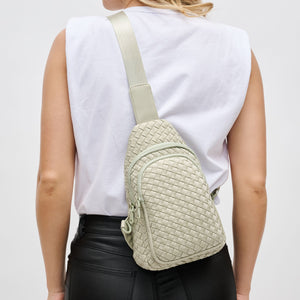 Woman wearing Sage Sol and Selene Beyond The Horizon - Woven Neoprene Sling Backpack 841764109086 View 1 | Sage