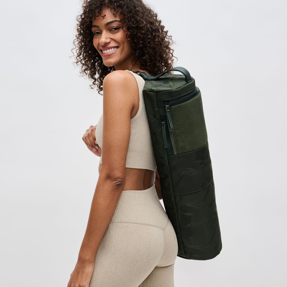 Woman wearing Olive Camo Sol and Selene Karma - Camo Print Yoga Mat Bag 841764100816 View 2 | Olive Camo