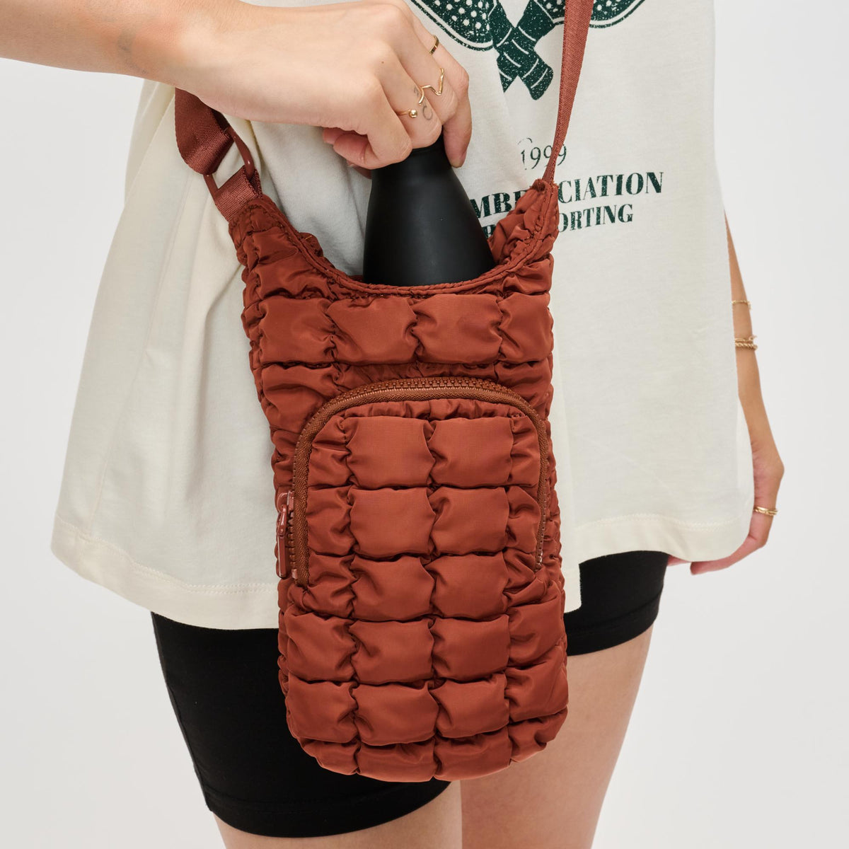 Woman wearing Rust Sol and Selene Let It Flow - Quilted Puffer Crossbody 841764110426 View 4 | Rust