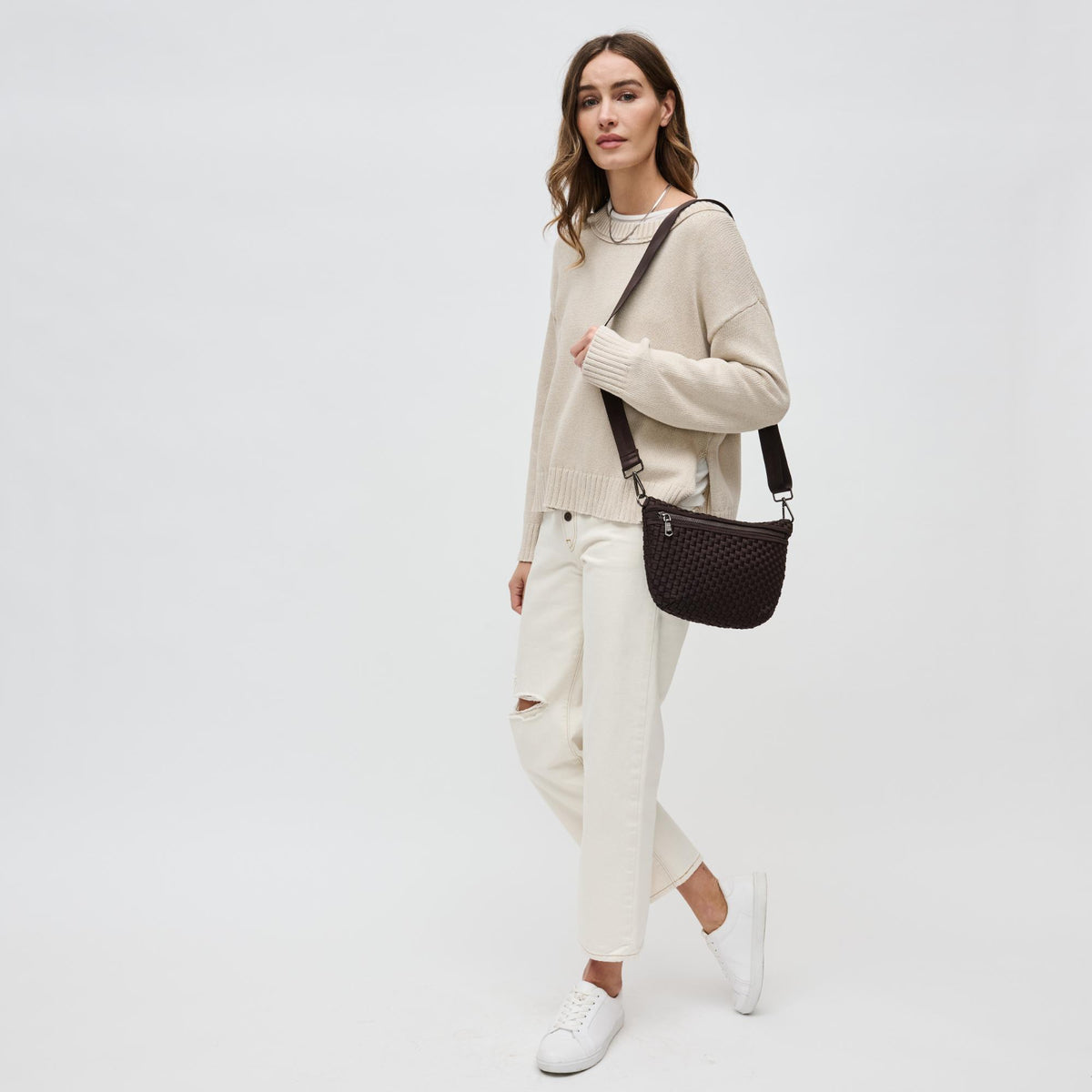 Woman wearing Chocolate Sol and Selene Ethereal - Woven Neoprene Crossbody 841764110853 View 3 | Chocolate