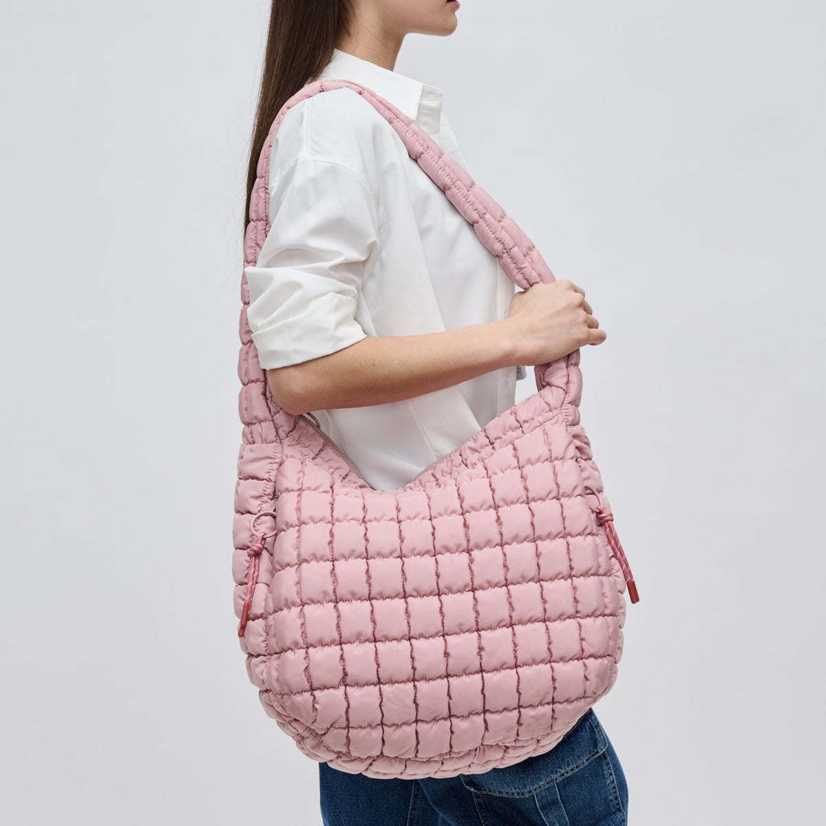 Woman wearing Rose Sol and Selene Revive Hobo 841764109543 View 1 | Rose