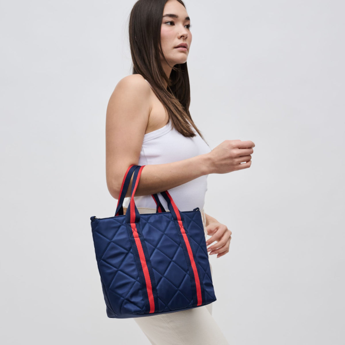 Woman wearing Navy Sol and Selene Motivator Mini Tote Mini Tote 841764106511 View 1 | Navy