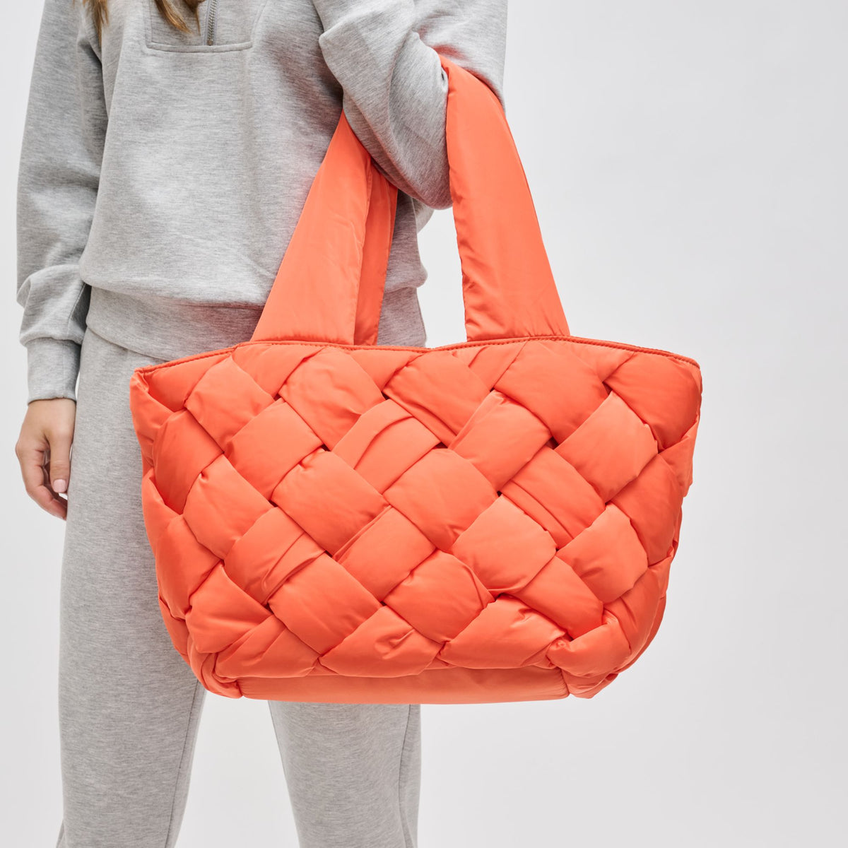 Woman wearing Tangerine Sol and Selene Intuition East West Tote 841764107310 View 4 | Tangerine