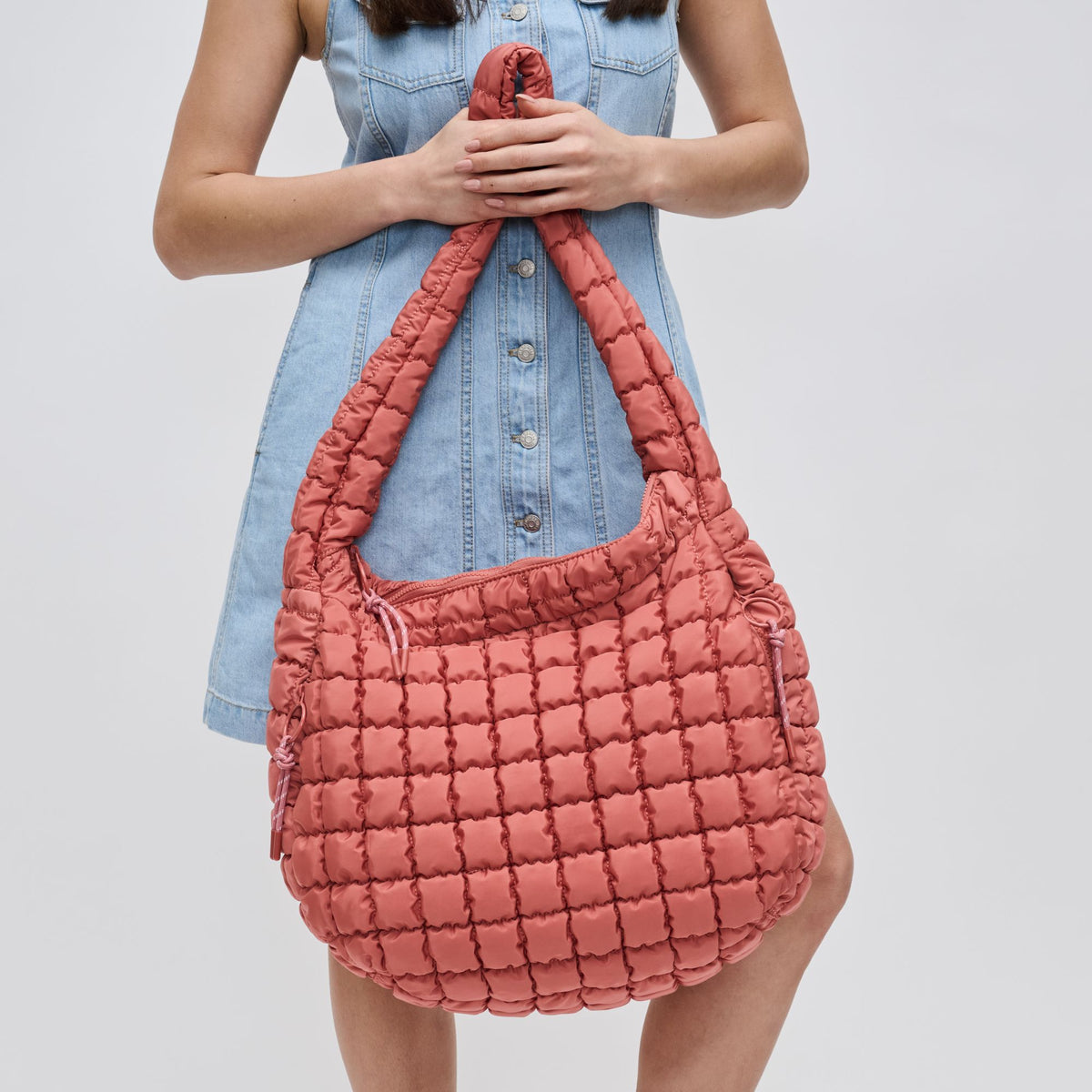 Woman wearing Terracotta Sol and Selene Revive Hobo 841764109550 View 4 | Terracotta