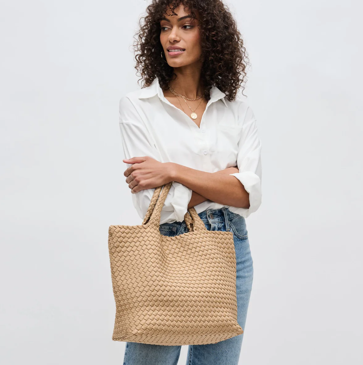 model carrying a medium tote bag