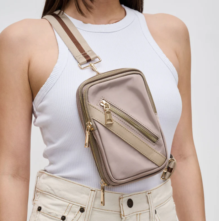 model wearing a sling backpack