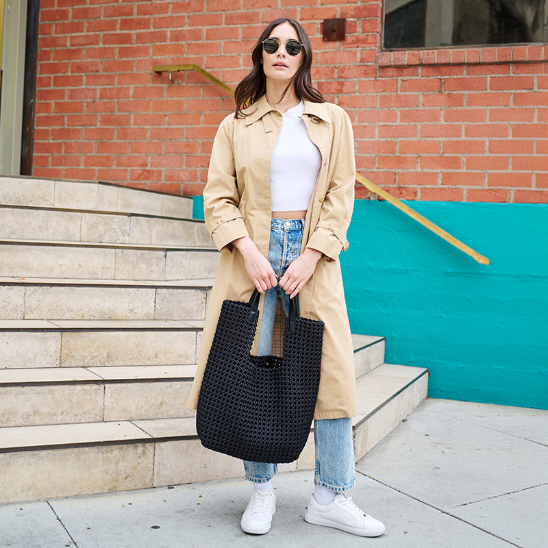 woman with black tote